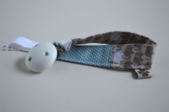 Bild von Schnullerband Elefanten beige/petrol